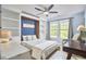 The bedroom features a built-in Murphy bed with shelving, and a window with curtains at 1238 Exchange Pl, Durham, NC 27713