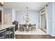 Bright dining area featuring a wooden table set, art, and sliding glass doors at 1238 Exchange Pl, Durham, NC 27713