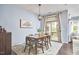 Charming dining area with a wooden table, rug, and sliding door at 1238 Exchange Pl, Durham, NC 27713
