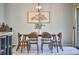 Comfortable dining area with a wooden table set and decorative light fixture at 1238 Exchange Pl, Durham, NC 27713