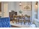 Cozy dining area with wooden table, stylish chandelier, and modern art at 1238 Exchange Pl, Durham, NC 27713