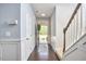 Bright entryway with hardwood floors, fresh paint, and a staircase to the upper level at 1238 Exchange Pl, Durham, NC 27713