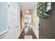 Inviting home hallway with hardwood floors, white trim, and staircase leading to the upper level at 1238 Exchange Pl, Durham, NC 27713