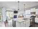 Open concept kitchen with granite countertops, stainless steel appliances and breakfast bar at 1238 Exchange Pl, Durham, NC 27713