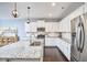 Spacious kitchen with granite island, stainless steel appliances, and hardwood floors at 1238 Exchange Pl, Durham, NC 27713