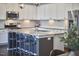 Modern kitchen featuring granite countertops, stainless steel appliances, and a stylish island with seating at 1238 Exchange Pl, Durham, NC 27713