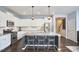 Modern kitchen with stainless appliances, granite countertops, and central island at 1238 Exchange Pl, Durham, NC 27713