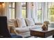 Bright living room with large windows, comfortable seating, and stylish decor at 1238 Exchange Pl, Durham, NC 27713