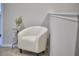 This loft area features a comfortable chair, a small table with a plant, and neutral paint at 1238 Exchange Pl, Durham, NC 27713