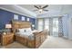 Spacious main bedroom features a decorative wall and a large bed with a ceiling fan at 1238 Exchange Pl, Durham, NC 27713