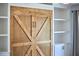 This picture shows a close up of the wooden Murphy bed with built in bookshelves at 1238 Exchange Pl, Durham, NC 27713