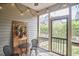 Screened in porch with string lights, hanging planters and outdoor seating at 1238 Exchange Pl, Durham, NC 27713