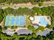 A sprawling community aerial view showcasing tennis and basketball courts next to the pool area at 1241 Dalgarven Dr, Apex, NC 27502