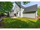 Beautifully landscaped backyard features a patio and pergola perfect for outdoor entertaining and relaxation at 1241 Dalgarven Dr, Apex, NC 27502