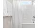 Clean bathroom with a shower over tub combo and a small window for ventilation and natural light at 1241 Dalgarven Dr, Apex, NC 27502