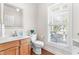 Bright half-bath with hardwood floors, natural light and modern fixtures at 1241 Dalgarven Dr, Apex, NC 27502