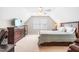 Comfortable bedroom with a bed, dresser and television, plus a ceiling fan and a vaulted ceiling at 1241 Dalgarven Dr, Apex, NC 27502