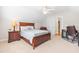 Comfortable bedroom with carpet flooring, a ceiling fan, and a large bed at 1241 Dalgarven Dr, Apex, NC 27502
