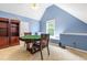 Large game room, featuring a card table, window seating and built in shelving at 1241 Dalgarven Dr, Apex, NC 27502