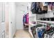 Organized walk-in closet with shelves and hanging rods to maximize storage space and organization at 1241 Dalgarven Dr, Apex, NC 27502