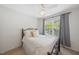 Bright bedroom with a dark metal bedframe, soft natural light, and cozy decor at 126 Star Thistle Ln, Cary, NC 27513
