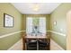 Cozy dining area featuring a modern table and chairs, with natural light streaming through the window at 126 Star Thistle Ln, Cary, NC 27513