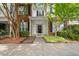 Charming townhome with brick accents, manicured landscaping, and a welcoming front entrance at 126 Star Thistle Ln, Cary, NC 27513