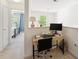 Bright home office with modern desk, large monitor and lots of natural light at 126 Star Thistle Ln, Cary, NC 27513