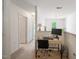 Bright home office with modern desk, large monitor and lots of natural light at 126 Star Thistle Ln, Cary, NC 27513