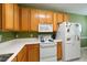 Traditional kitchen with light oak cabinets, white countertops, and modern appliances at 126 Star Thistle Ln, Cary, NC 27513