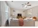 Inviting living room showcasing a spacious sofa, TV, and open view into the adjacent kitchen at 126 Star Thistle Ln, Cary, NC 27513