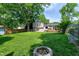 Enjoy the expansive backyard, featuring a lush lawn, a fire pit, and plenty of room to play at 1321 Bloomingdale Dr, Cary, NC 27511