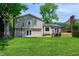 Expansive backyard features a well-maintained lawn, a deck and lush trees at 1321 Bloomingdale Dr, Cary, NC 27511