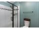 Full bathroom featuring a glass shower door, white subway tiles, and a shower head at 1321 Bloomingdale Dr, Cary, NC 27511