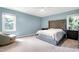 This bedroom has carpet, a ceiling fan, and two windows for natural light at 1321 Bloomingdale Dr, Cary, NC 27511