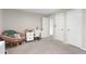 Charming bedroom featuring a cozy papasan chair and a bright workspace with sewing machine at 1321 Bloomingdale Dr, Cary, NC 27511
