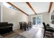 Bright dining room features wood beams, a modern rug, and access to the outdoors through sliding glass doors at 1321 Bloomingdale Dr, Cary, NC 27511