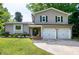 Charming two-story home featuring a two-car garage and well-maintained front lawn at 1321 Bloomingdale Dr, Cary, NC 27511