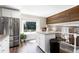 Bright kitchen featuring stainless steel refrigerator and a kitchen island at 1321 Bloomingdale Dr, Cary, NC 27511