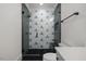 Modern bathroom with geometric tile shower and black fixtures at 1400 Hedgelawn, Raleigh, NC 27615