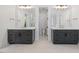 Spacious bathroom with dual vanities, stylish fixtures, and a separate toilet room at 1400 Hedgelawn, Raleigh, NC 27615