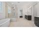 Bathroom with a soaking tub, glass shower, and a vanity with modern fixtures at 1400 Hedgelawn, Raleigh, NC 27615