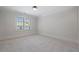 Bedroom with a window, neutral carpet, and white walls at 1400 Hedgelawn, Raleigh, NC 27615