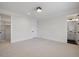 Spacious bedroom with neutral carpet, white walls, and ensuite bathroom at 1400 Hedgelawn, Raleigh, NC 27615