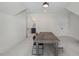 Bonus room with rustic wood table, neutral carpet, and ensuite bathroom at 1400 Hedgelawn, Raleigh, NC 27615