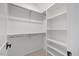 Walk-in closet with custom shelving, providing ample storage for organization at 1400 Hedgelawn, Raleigh, NC 27615