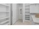 Walk-in closet with custom shelving and ample storage space, providing organization at 1400 Hedgelawn, Raleigh, NC 27615