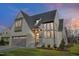 Beautiful exterior elevation of home with large windows and meticulously kept lawn at 1400 Hedgelawn, Raleigh, NC 27615