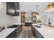 Kitchen featuring stainless steel appliances, a white island, and a bar area with a wine cooler at 1400 Hedgelawn, Raleigh, NC 27615