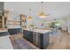 Spacious kitchen with a large island, stainless steel appliances, and wood floors at 1400 Hedgelawn, Raleigh, NC 27615